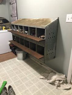 a room with some shelves and shoes on the floor