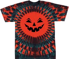 an orange and black tie - dye t - shirt with a grinning pumpkin face on it