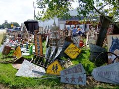 a bunch of signs that are sitting in the grass