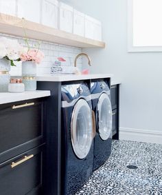 an instagram photo of a washer and dryer in a room with white walls