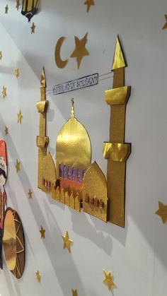 the wall is decorated with gold and red decorations