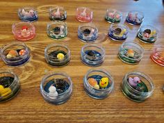 small plastic containers filled with different types of candies