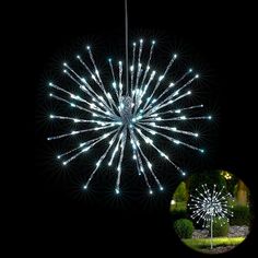 a large white fireworks is lit up in the dark