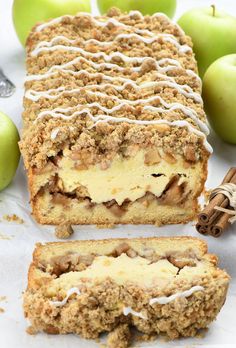 an apple crumb cake with white icing and cinnamon on top, surrounded by apples