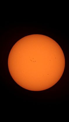 the sun seen from space in front of a dark sky with small birds on it