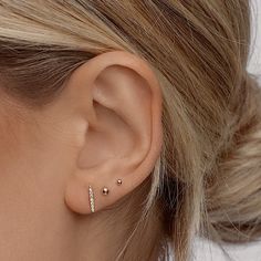 Classic & timeless, these studs are perfect for a minimal effortless look. Truly perfect in any piercing location. Our teeny tiny 2mm size is made for those 2nd, 3rd, and 4th cartilage piercings. Safe for sensitive skin, our pieces are hand crafted and made to wear 24/7. Available in 2 ball sizes, 2mm (super tiny) and 3mm (small) 3mm available in gold filled or 14k solid gold, 2mm available only in solid 14k gold. Available as a single stud or in a pair. These earrings come with our signature mini push-on butterfly backings for the most hygienic and comfortable fit. Less metal behind your ears means less build-up and more room for multiple piercings close together. Tiny Minimalist 14k Gold Cartilage Earrings, Tiny Gold Sterling Silver Cartilage Earrings, Tiny Earrings Studs, Tiny Yellow Gold Sterling Silver Piercings, Silver 14k Gold-filled Single Cartilage Earring, 2nd Ear Piercing, Hypoallergenic Silver 14k Gold-filled Cartilage Earrings, Baby Ball, Cartilage Piercings