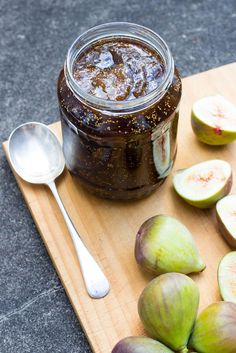 figs and jam on a cutting board with spoon