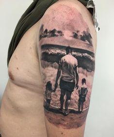 a man with a family tattoo on his arm