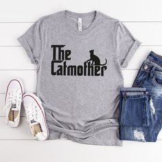 The Catmother Shirt, Crazy Cat Lady, Funny Cat T Shirt, Feline Love Gifts Shirt, Mother's Day Gift, Cat Mom Gift, Cat Mom Shirt How to Order?  1-Choose your t-shirt color, 2- Choose your size, 3- Select the quantity, 4- Click Add to Cart.  Production and shipping: * 100% airlume combed and ring-spun cotton, 32 singles 4.2 oz. * Solid colors are %100 cotton * Heathers are %52 cotton %48 polyester * Athletic Heather is combed and ring-spun cotton, 10% polyester * Seamless collar * Heat transfer la Crazy Cat Lady Shirt, Cat Lady Humor, Cat Mom Shirt, Cat Tshirts Funny, Cat Mom Shirts, Cat Mom Gifts, Cat T Shirt, Crazy Cat, Cat T