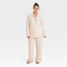 After a long day, you'll love winding down and getting some rest in this Ribbed Split Long-Sleeve Notch Collar Shirt and Pants Pajama Set from Auden™. The pajama set includes a long-sleeve shirt with a notched collar, a chest patch pocket, a full-length button-down front and side slits. It’s paired with matching pajama pants with an elastic waistband with a drawstring for a customizable fit. Made of a rayon-spandex blend with a ribbed texture, this solid-color PJ set helps you enjoy a good night Notch Collar Shirt, Matching Pajama, Elastic Waistband Pants, Pajama Pant, Matching Pajamas, Notch Collar, Ribbed Texture, Short Pajama Set, Knit Shorts