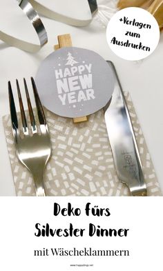 forks and silverware are sitting on a napkin with the words happy new year