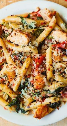 Creamy Chicken Pasta with, Spinach, and Tomatoes in Garlic Cream Sauce on a plate Pasta With Spinach And Tomatoes, Chicken And Bacon Pasta, Popular Pasta Recipes, Pasta With Spinach, Chicken And Bacon, Creamy Chicken Pasta, Garlic Cream Sauce, Bacon Pasta