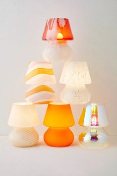 several different colored lamps sitting next to each other