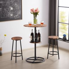 two stools and a table with bottles on it