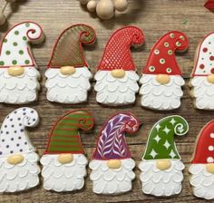 decorated cookies are arranged in the shape of gnomes