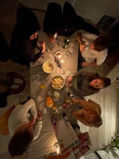 a group of people sitting around a dinner table