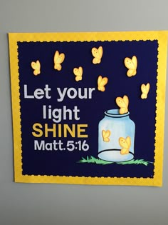 a blue and yellow bulletin board with butterflies on it that says let your light shine matt 516