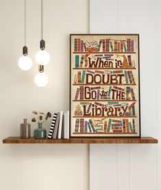 there is a book shelf with books on it and two lights hanging from the ceiling