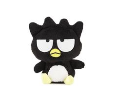 a black and white stuffed animal with yellow eyes