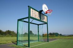 an outdoor basketball court with a goal and hoop