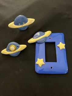 a blue and yellow plastic toy with space related items