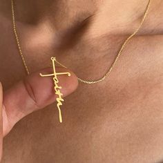 This 14k solid gold Faith necklace, featuring a unique cross-shaped design, combines elegance with deep spiritual meaning. Perfect for those who cherish their faith, this signature name necklace is both stylish and symbolic. Ideal as a Christian gift, it's perfect for wearing daily or gifting on special occasions to celebrate faith and devotion. Key Features: *Material: 14k solid gold *Customization: Laser engraving available *Craftsmanship: Handmade, made to order *Packaging: Ready to gift, comes in an elegant gift box *Design: Minimalist and timeless *Versatility: Suitable for everyday wear or special occasions Faith Necklace, Gift Box Design, Faith Gifts, Meaningful Jewelry, Christian Jewelry, Cool Necklaces, Religious Jewelry, Birthday Gifts For Women, Religious Gifts