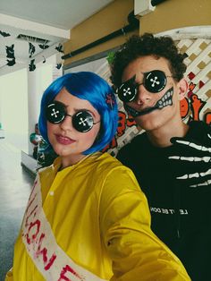 two people with fake eyes and painted faces