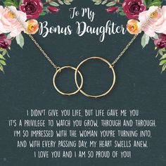 a mother and daughter poem with two intertwined circles on a black background surrounded by flowers