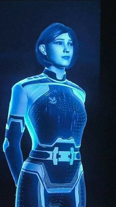 a woman in a futuristic suit with glowing lights on her chest and hands behind her back