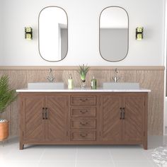 a bathroom with two sinks and mirrors on the wall next to a potted plant