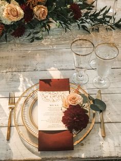 Burgundy gold and white wedding reception decoration Burgundy And Terracotta Wedding Table, Burnt Orange Wedding Place Setting, Terracotta Burgundy Gold Wedding, Terracotta And Gold Wedding Decor, Gold Rimmed Plate Table Setting, Terrocata And Burgundy Wedding, Fall Wedding With Gold Accents, Wedding Plate Setting Fall, Bride And Groom Table Burgundy