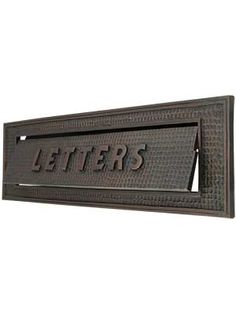 a metal sign that says letters on it