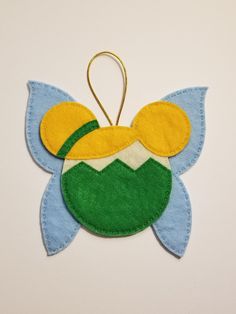 "Each adorable felt ornament is hand stitched with beautiful details. Tinkerbell is 5.5 x 6 inches  There is a 3\" loop for easy hanging on your tree. This will make a great Christmas ornament for you or a loved one that loves these characters." Dia De Los Muertos Crafts Ideas, Christmas Disney Ears, Disney Felt Ornaments, Tinkerbell Ornament, Disney Princess Ornaments, Beatrix Potter Birthday, Mickey Mouse Ornaments, Disney Applique, Disney Xmas