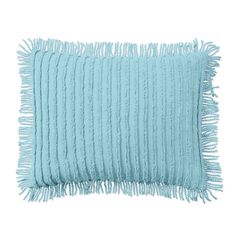 a light blue pillow with fringes on it