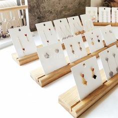 there are many earrings on display in the store