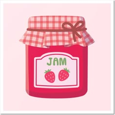 a jar of jam with two strawberries on the label and a bow around it