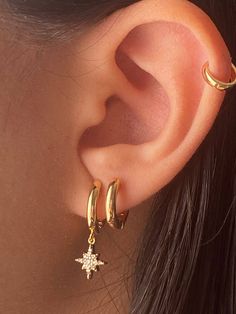 These 18K 18K Gold Filled Dangling Sun CZ Clicker Earrings are the perfect everyday lookMaterial18K Gold Filled StonesCubic Zirconias Size12mm outer Dimensions11 Inner Dimensions ClosureClicker *Comes as a pair Gold-filled is an actual layer of gold pressure-bonded to brassGold filled is not to be confused with gold plating as it is filled with literally 100more gold than gold platingGold-filled is much more valuable and more durable. Cute Ear Piercings, Jewelry Accessories Ideas, Classy Jewelry, Jewelry Lookbook, Girly Jewelry, Stunning Jewellery