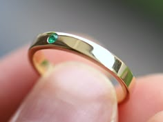 Emerald wedding band, emerald wedding ring, 3mm wedding band, Simple emerald band, emerald stacking ring, dainty emerald ring women Available in 9k/14k yellow, rose or white gold. Same design can be made also with other custom gemstones per request. Product details: - Solid gold - 2mm emerald - Band width is 3mm - Made to order - 8 to 10 business days. Ring size - US 3 to US 9 (for smaller or larger ring size, please contact) Please select your size at the drop down menu. Service Available - Cus 3mm Wedding Band, Wedding Band Simple, Emerald Wedding Band, Simple Wedding Bands, Emerald Band, Emerald Wedding Rings, Petite Ring, Green Stone Rings, Emerald Wedding