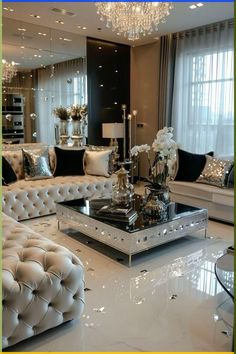 a living room filled with white furniture and lots of pillows on top of each other