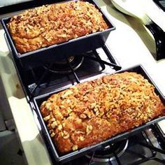 three pans filled with food sitting on top of a stove