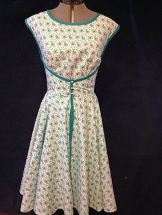 This dress is a 1952 Wrap Dress I can custom make to fit your size. It is a turquoise color with matching ribbon wrapped around the entire dress. There will be three small vintage buttons added similar to the ones shown. This is a beautiful wrap dress - form fitting but flows over the hips. This material is broadclothe poly cotton blend and has the look of a Doris Day dress in her much loved movies from the 50s and early 60s. Have fun with this vintage inspired wrap dress. Vintage Wrap Dress Pattern, Vintage Sundresses, Morgan Donner, Apron Dress Pattern, Dress Patterns Vintage, Disney Sewing, Swimsuits Vintage, 1940s Dress Pattern, 1950s Clothes