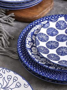 blue and white plates stacked on top of each other