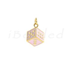 a pink and white dice charm on a gold plated silver chain, with the word'd'in it