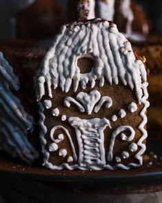 a gingerbread house is decorated with icing