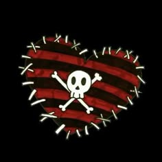 a skull and crossbones in the shape of a heart on a black background