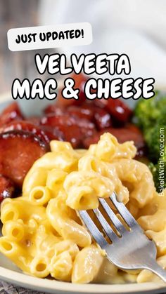 a plate full of macaroni and cheese next to broccoli with the words, just updated velveeta mac & cheese