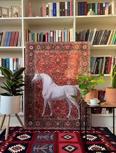 a white horse standing on top of a rug in front of a bookshelf