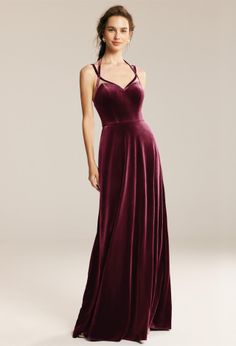 a woman in a long velvet dress