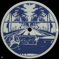 a blue and white disc with an image of a car driving down the road in front of trees