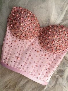 Looking for something elegant and fun? This pink satin bustier / corset top is handmade with care and perfect for any occasion. Highlights: Smooth, luxurious satin in a soft pink shade. Gorgeous pearls and crystals, all hand-applied. Designed to fit beautifully and comfortably. Adjustable straps for the perfect fit. Dress it up or keep it casual--this bustier is your new go-to! Need help with sizing? Just send me a message, I'm happy to assist! Bridal Corset Top, Rose Corset, Satin Corset Top, Pearl Top, Satin Bustier, Bridal Corset, Pink Corset, Corset Bustier, Special Occasion Outfits